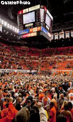 OSU fans rush the court after the Cowboys' stunning upset of top-ranked Kansas.