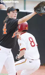 Julie Ward caught a line drive down the rightfield line to preserve the Cowgirls' 4-3 win.