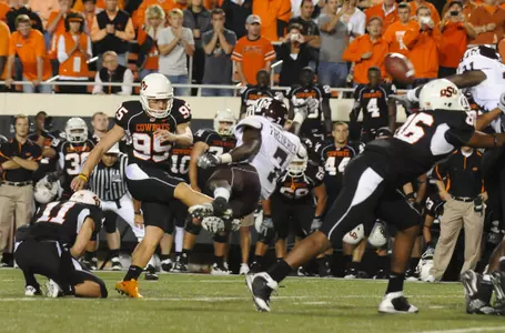 Oklahoma State's Dan Bailey (95) kicks the winning 40-yard field goal as time expires in an NCAA college football game against Texas A&M in Stillwater, Okla., Thursday, Sept. 30, 2010. Oklahoma State won 38-35.(AP Photo/Brody Schmidt)