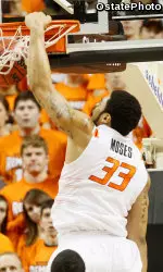 Marshall Moses slams home two of his team-high 14 points against Texas.