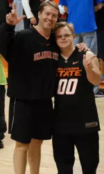 Coach Ford and a Cowboy Basketball fan take a break during Wednesday's basketball training.