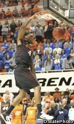 Brian Williams hammers down a dunk during Homecoming & Hoops last Friday night.
