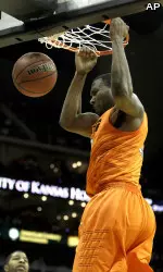 Matt Pilgrim dunks for two points against Kansas in the quarterfinals of the Big 12 Championship.
