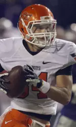Austin Hays races to the end zone ahead of Kansas State defensive back Nigel Malone to score a touchdown. (AP Photo/Orlin Wagner)