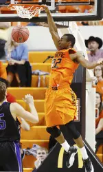 Markel Brown dunks against Central Arkansas.