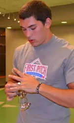 Nico Ornelas is sized for a ring as part of reporting day.