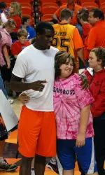 Jean-Paul Olukemi poses for a picture with one of the athletes during last year's Special Olympics Clinic.