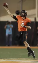 J.W. Walsh passes against Texas in the first quarter. (AP Photo/Sue Ogrocki)