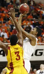 Le'Bryan Nash shoots in front of Iowa State forward Melvin Ejim.