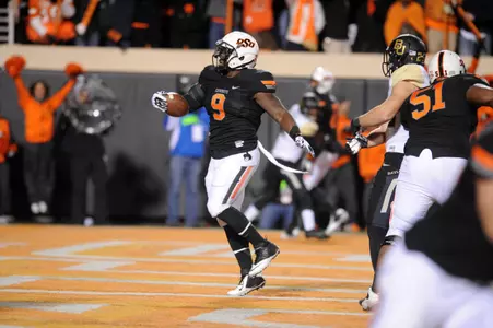Oklahoma State Cowboys running back Kye Staley (9) scores a touchdown against the Baylor Bears in the first quarter at Boone Pickens Stadium. Mandatory Credit: Mark D. Smith-USA TODAY Sports