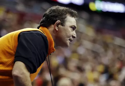 Oklahoma State coach John Smith watches a match between Alex Dieringer and Ohio's Spartak Chino in a 157-pound match at the NCAA Division I college wrestling championships, Thursday, March 21, 2013, in Des Moines, Iowa. (AP Photo/Charlie Neibergall)