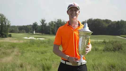 Jordan Niebrugge poses for a picture with the U.S. Amateur Public Links trophy after the conclusion of the final round of match play at the 2013 U.S. Public Links at Laurel Hill Golf Club in Lorton, Va. on Saturday, July 20, 2013. (Copyright USGA/Joel Kowsky)