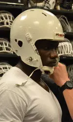 Redshirt Freshman DE Victor Irokansi gets fitted for his helmet Thursday