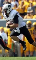 Quarterback J.W. Walsh (4) runs with the ball during the first quarter. Mandatory Credit: Peter Casey-USA TODAY Sports