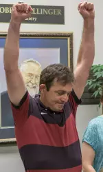 John Smith celebrating the IOC's decision to include wrestling in the 2020 Olympics.