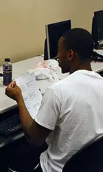 Markel Brown utilizes the computer lab in the Joe and Connie Mitchell Academic Enhancement Center inside Gallagher-Iba Arena.
