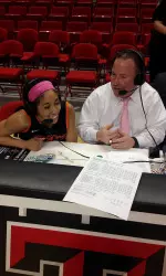 Casey Kendrick visits with Tiffany Bias following her game-winning basket at Texas Tech last season.