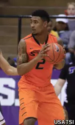 Le'Bryan Nash (2) looks to drive during the first half.