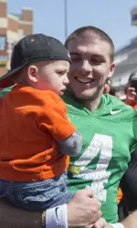 Fans can interact with the Cowboy football team on the field following the spring game.