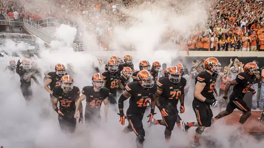 Football team takes field smoke