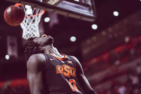 Isaac Likekele pumps up the home crowd after a steal and a slam.