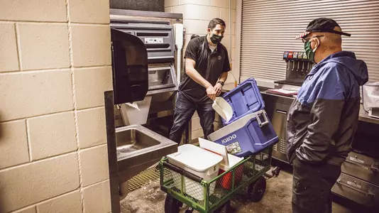 Image of OSU Covid-19 Testing Lab Workers Taken Thursday, April 9, 2020, Boone Pickens Stadium, Stillwater, OK. Bruce Waterfield/OSU Athletics