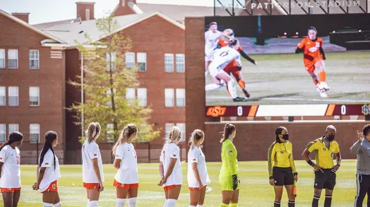 Team watching video board