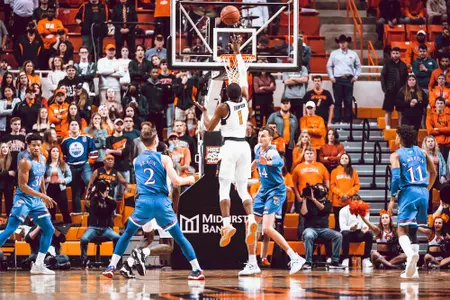 Bryce Thompson shoots over Kansas defense
