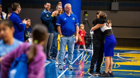 Jacie Hoyt Hugging Her Mom with Dad and Husband in Background