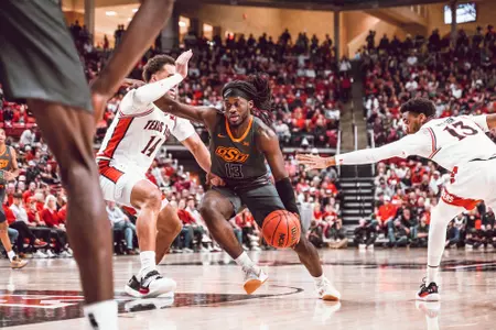 Isaac Likekele drives in lane at Texas Tech