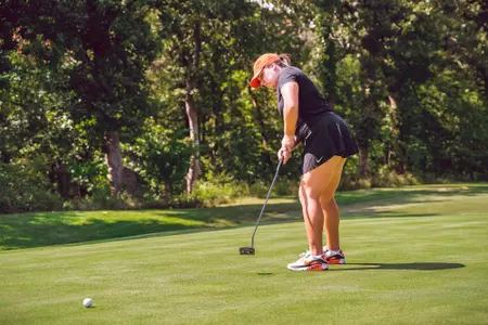 Jenna Solheim lines up putt at Karsten Creek