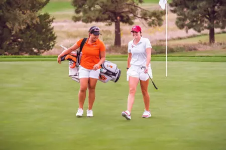 Han-Hsuan Yu walks off green in Norman