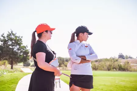 Jenna Solheim and Angelica look on in Norman