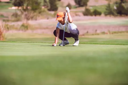 Rina Tatematsu lines up putt in Norman