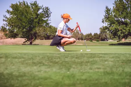 Maddison Hinson-Tolchard lines up putt in Norman