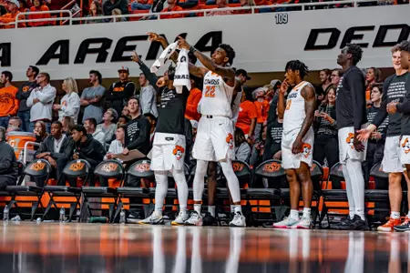 Cowboy Bench Celebrates During Iowa State Game