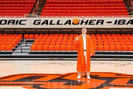 Carson Sager in Orange Graduation Gown