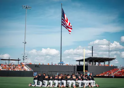 Team huddle with AM flag at O'Brate - 2024