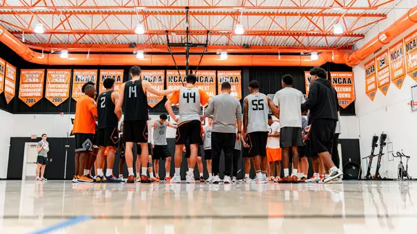 The Cowboys huddle up during a session in the practice gym.