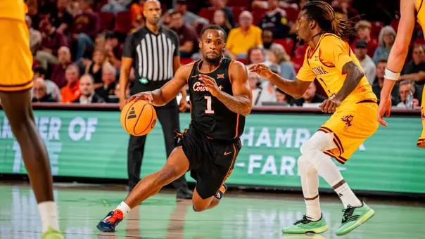 Clary driving to the basket