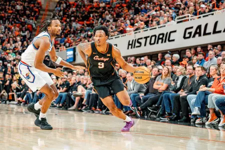 Anthony Roy drives to the basket during a 2026 game against Kansas in Gallagher-Iba Arena