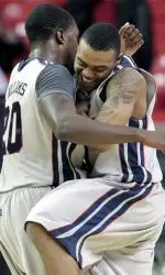 Nick Williams and Dundrecous Nelson celebrate Thursday's win (AP).