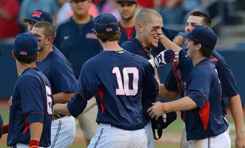 Matt Snyder and teammates celebrate the walk-off win over Tennessee.