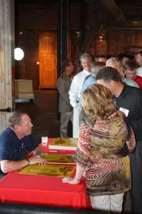Hugh Freeze visits with fans at the RRT event in Jackson (Courtesy Alumni Association).