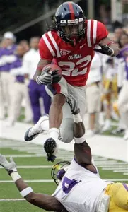 Dexter McCluster rushed for 148 yards and threw a touchdown pass to Shay Hodge in the Rebel victory.