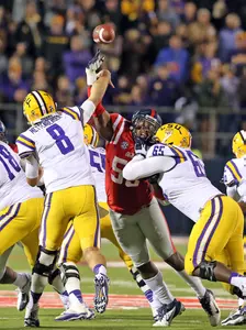 Cameron Whigham pressures LSU QB Zach Mettenberger (photo by Joshua McCoy).