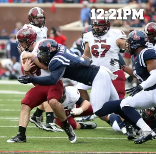 Robert Nkemdiche makes his first career sack (photo by Joshua McCoy).