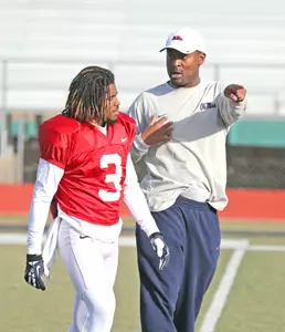 Senior RB Jeff Scott and RB coach Derrick Nix during Friday's practice