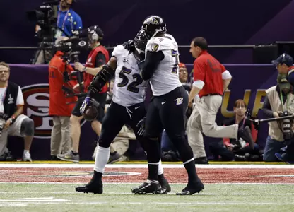 Michael Oher celebrates with teammate Ray Lewis during Super Bowl XLVII (photo by Derick Hingle - USA TODAY Sports)