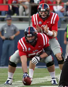 Evan Swindall snaps the ball to Bo Wallace. (photo by Joshua McCoy)